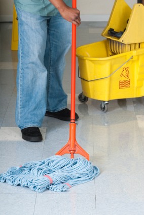 ProExcell Solutions janitor in La Grange Park, IL mopping floor.